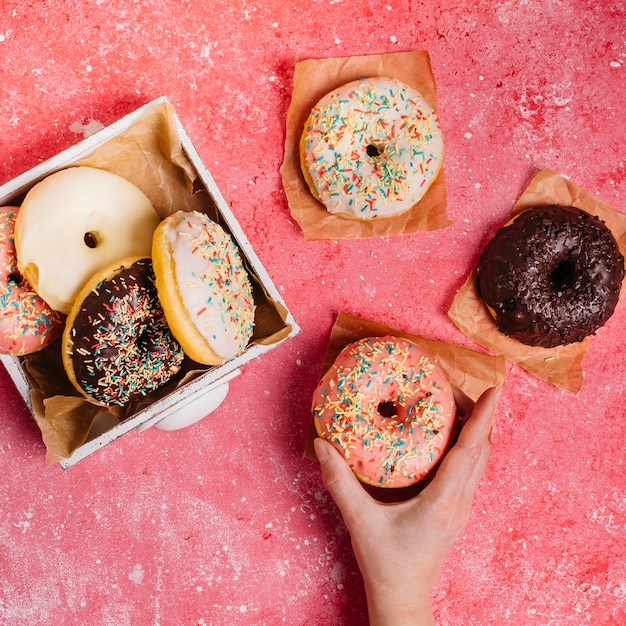 Flat lay composition of tasty donuts