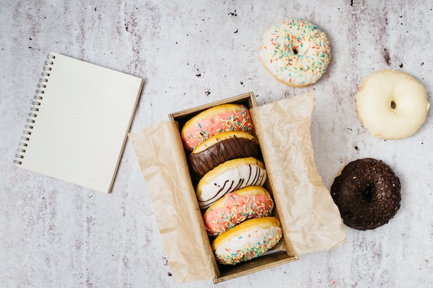 Flat lay composition of tasty donuts