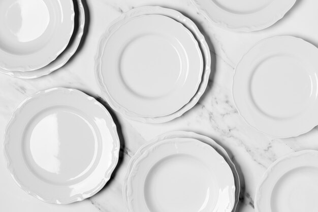 Flat lay composition of white plates