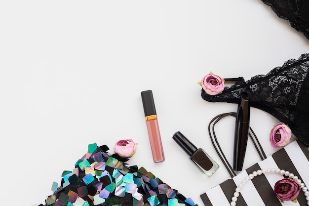 Free photo flat lay composition with make-up and underwear