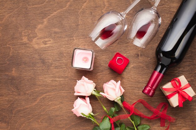 Free photo flat lay composition with wine and engagement ring