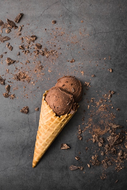 Flat lay cone with ice cream on table