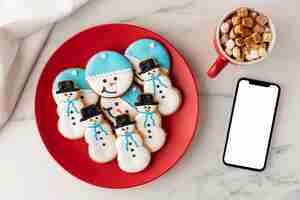 Free photo flat lay of cookies in snowman shape concept