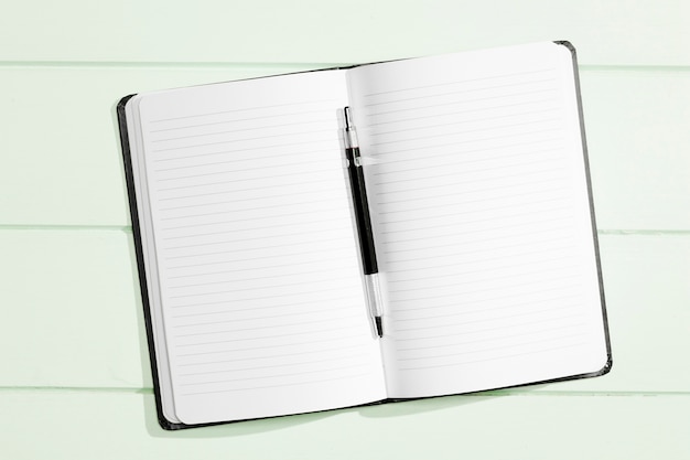 Flat lay copy space notebook with pen