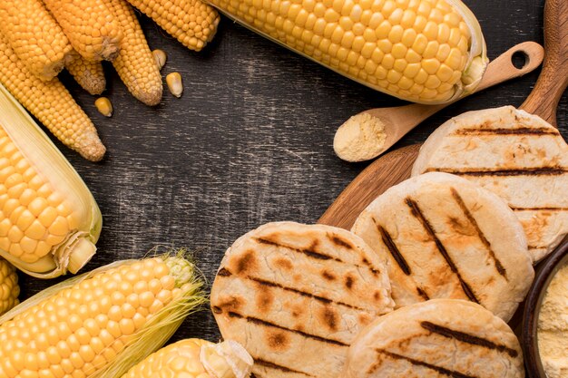 Flat lay corn and arepas arrangement