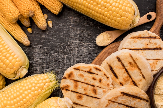 Flat lay corn and arepas arrangement