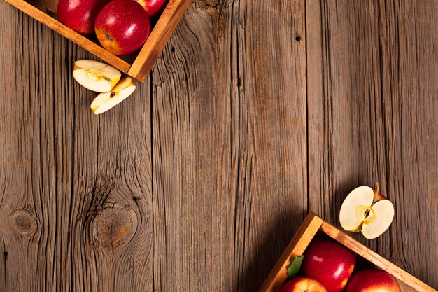 Flat-lay crate with ripe apples with copyspace