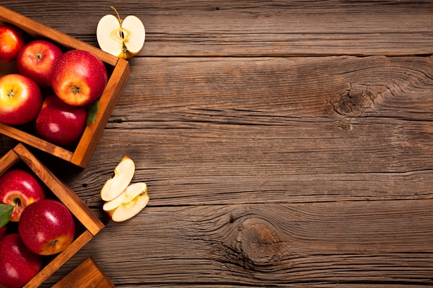 Flat-lay crate with ripe apples with copyspace