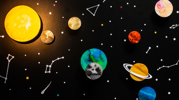 Flat lay creative paper planets composition