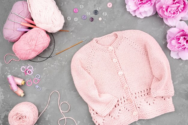 Flat lay of crocheted pink jacket