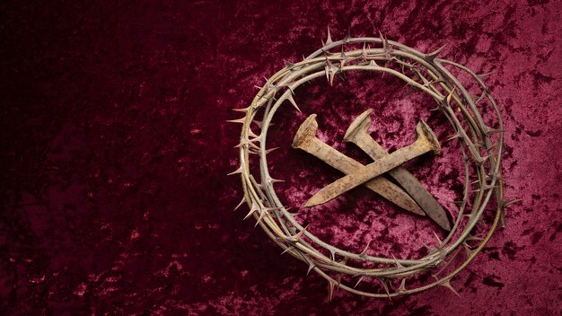 Flat lay crown of thorns and nails on cloth