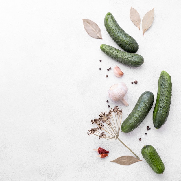 Free photo flat lay cucumbers frame with copy-space