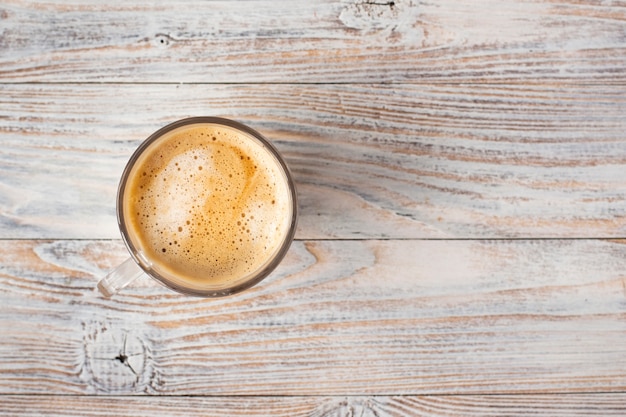 Flat lay of cup of coffee with foam