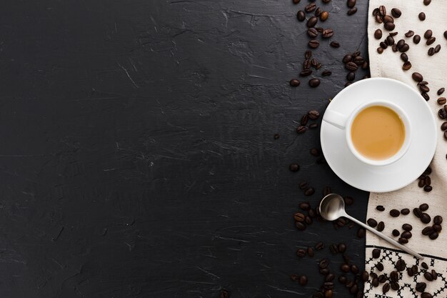 Flat lay of cup of coffee with spoon