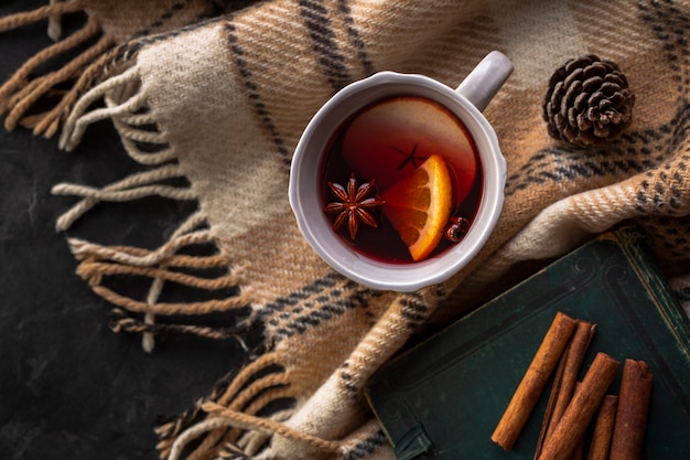 Flat lay cup with mulled wine and condiments