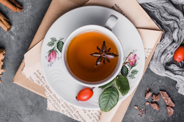 Flat lay cup with tea, star anise and cinnamon