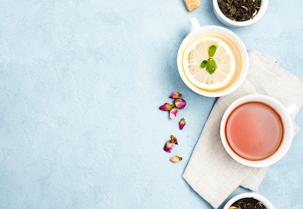 Free photo flat lay cups with tea and copy-space