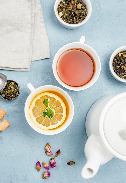 Flat lay cups with tea on desk