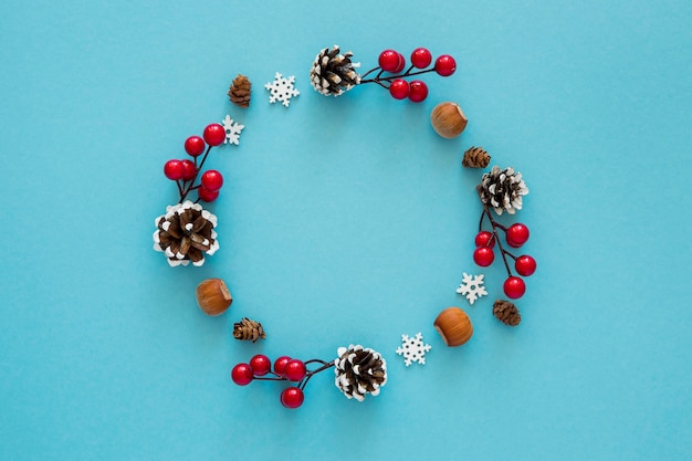 Free photo flat lay cute winter wreath of elements