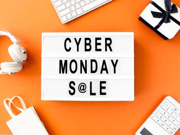 Flat lay of cyber monday light box with gift and shopping bag