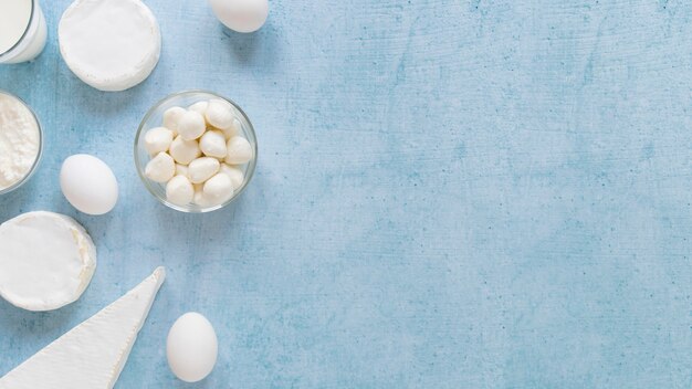 Flat lay dairy products on blue background