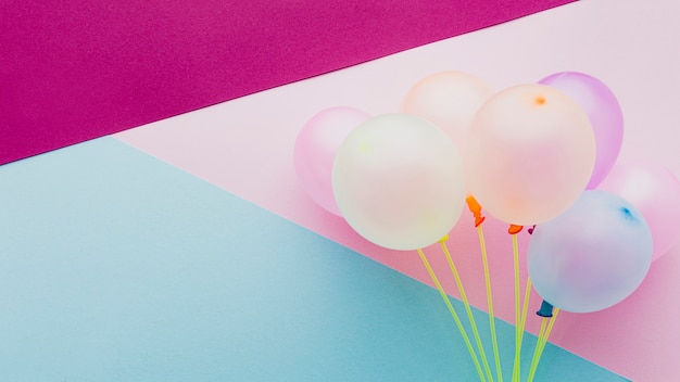Flat lay decoration with balloons and colorful background