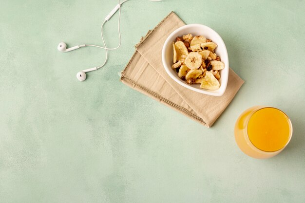 Flat lay decoration with breakfast and headphones