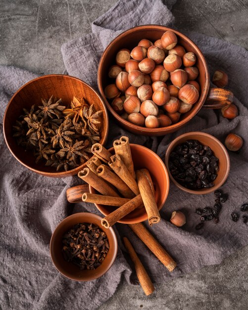 Flat lay decoration with cinnamon sticks and hazelnuts