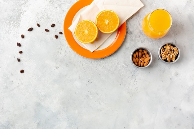 Free photo flat lay decoration with juice and nuts in bowls