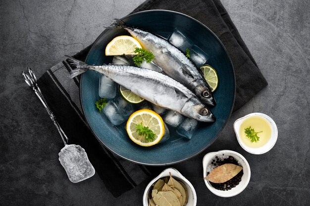 Flat lay decoration with lemons and fish