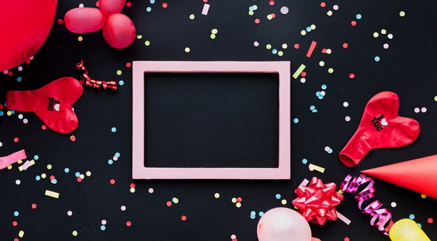 Flat lay decoration with red balloon and frame 