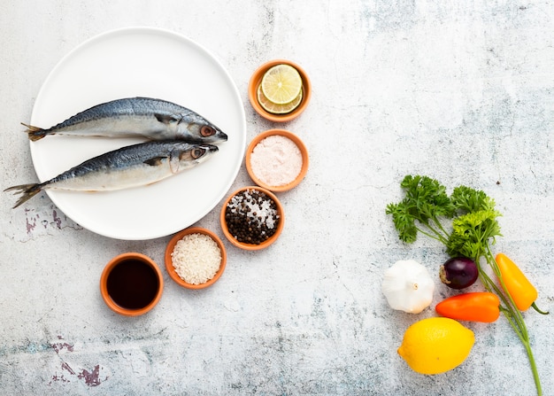 Free photo flat lay decoration with tasty fish and spices