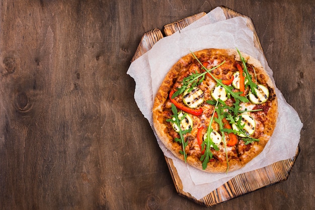 Flat lay delicious arugula pizza