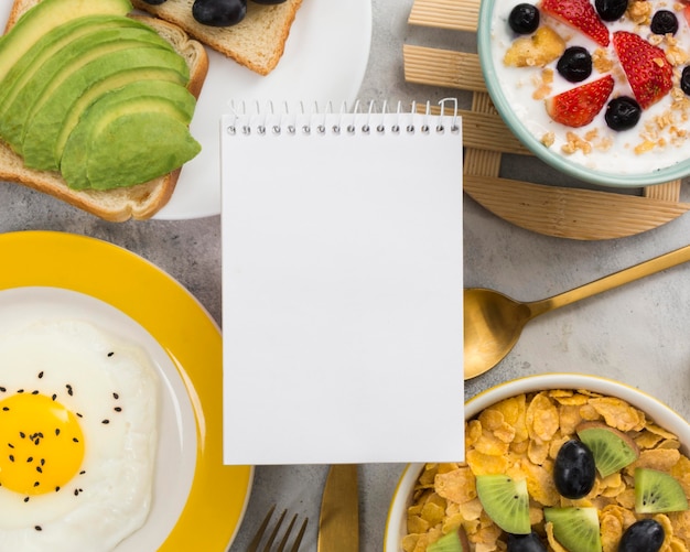 Flat lay of delicious breakfast with avocado