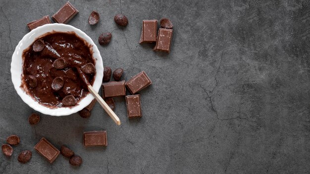 Flat lay delicious chocolate assortment with copy space