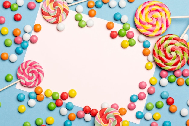 Free photo flat lay of delicious colorful candies