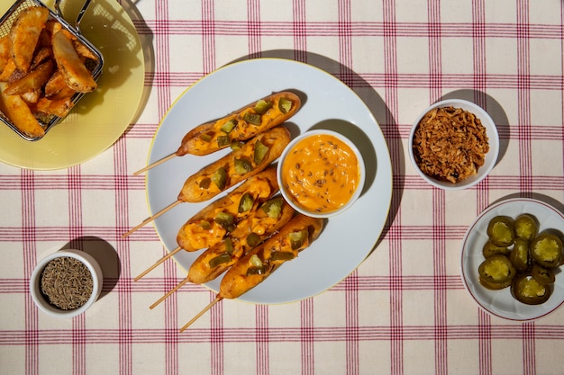 Free photo flat lay delicious corn dogs arrangement