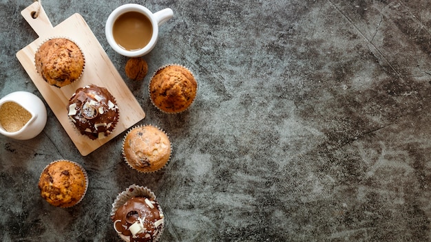 Flat lay of delicious cupcakes concept