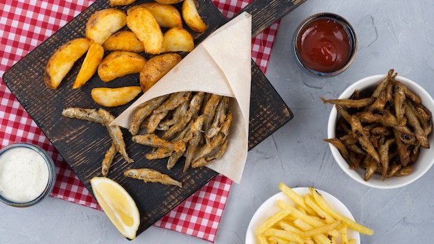 Flat lay of delicious fish and chips concept