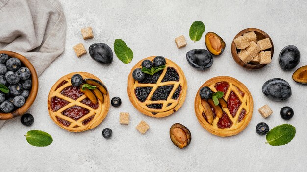 Flat lay of delicious fruit pies