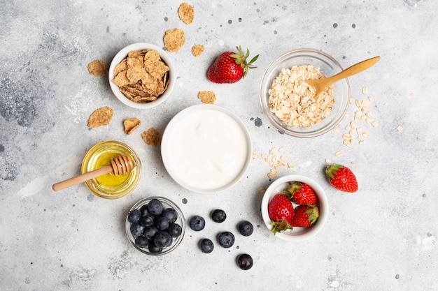 Free photo flat lay delicious fruits in bowls