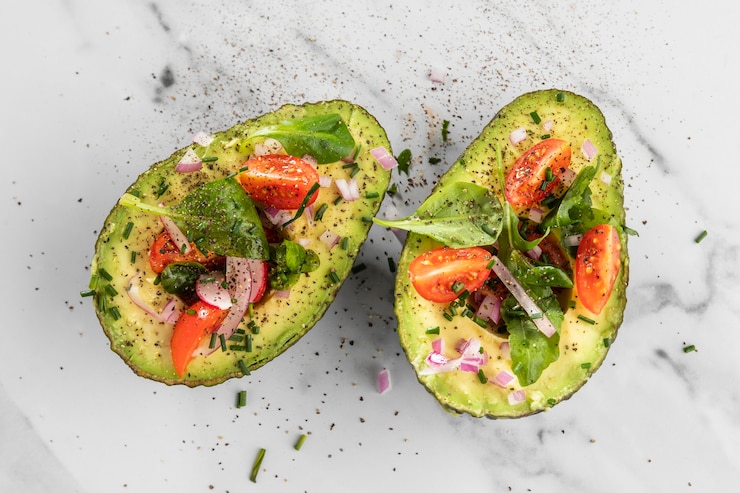 Free Photo flat lay delicious healthy salad in avocado composition