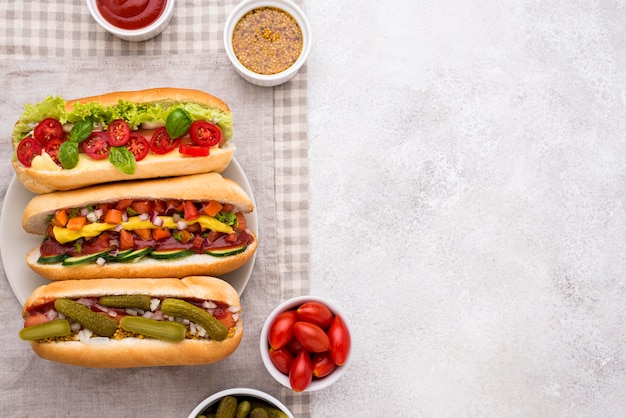 Flat lay delicious hot dogs frame