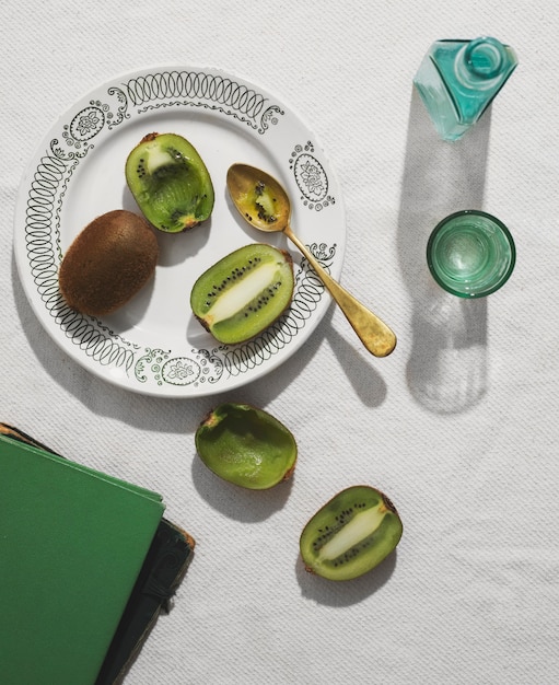 Flat lay delicious kiwi on plate