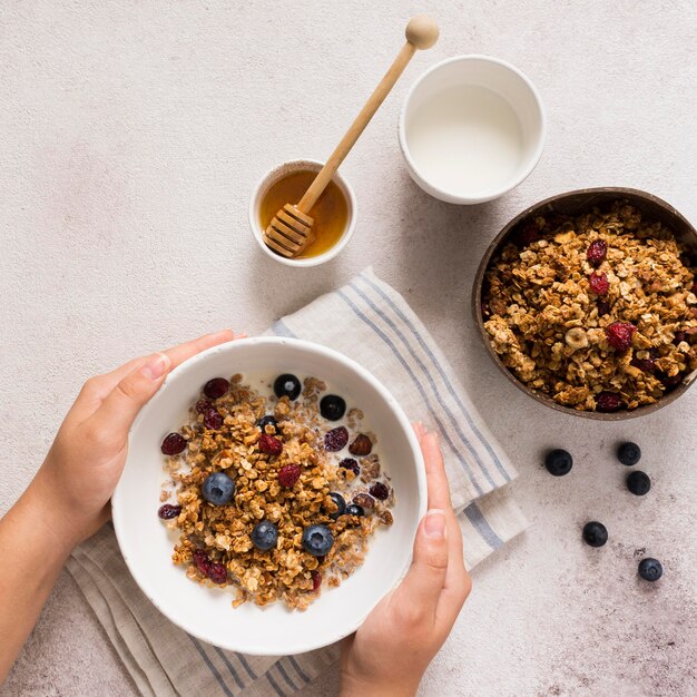 Flat lay of delicious muesli in bowl