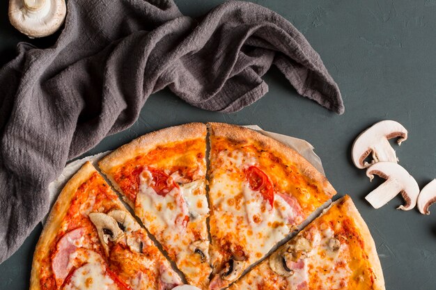 Flat lay of delicious pizza with mushrooms