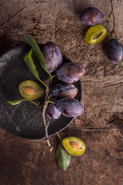 Flat lay delicious plums arrangement