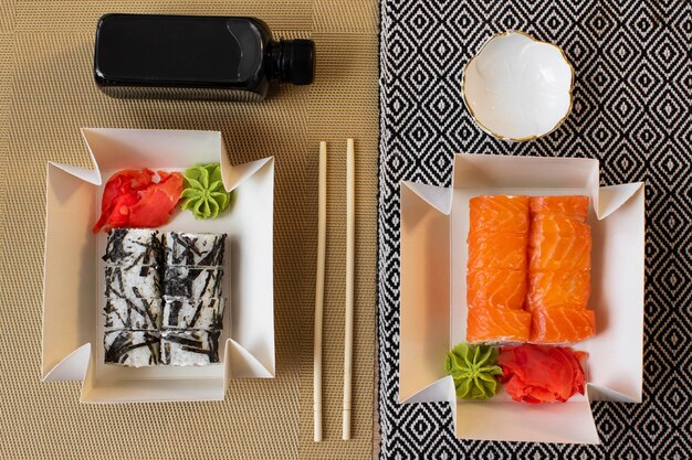 Flat lay delicious sushi on table