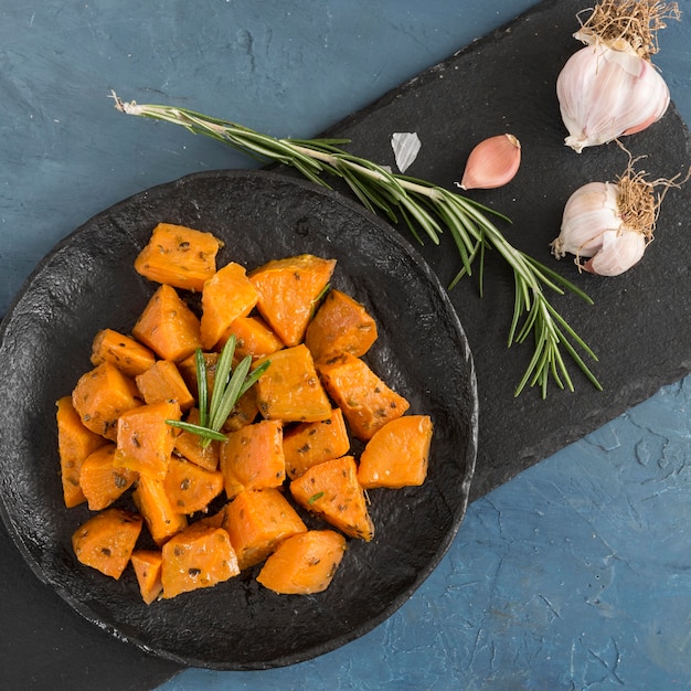 Free photo flat lay delicious sweet potatoes dish