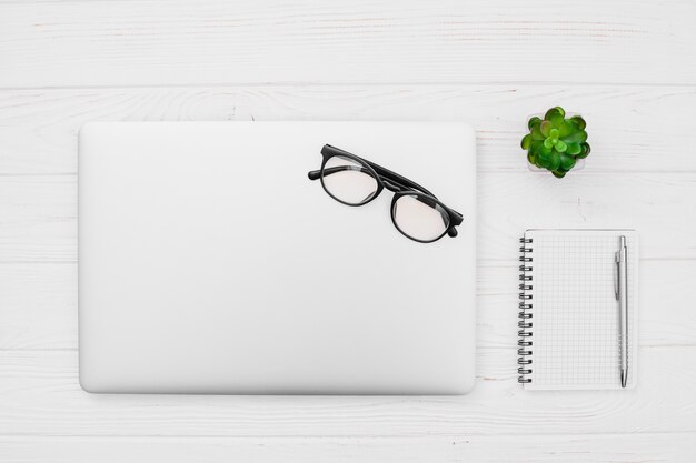 Flat lay desk concept with notepad